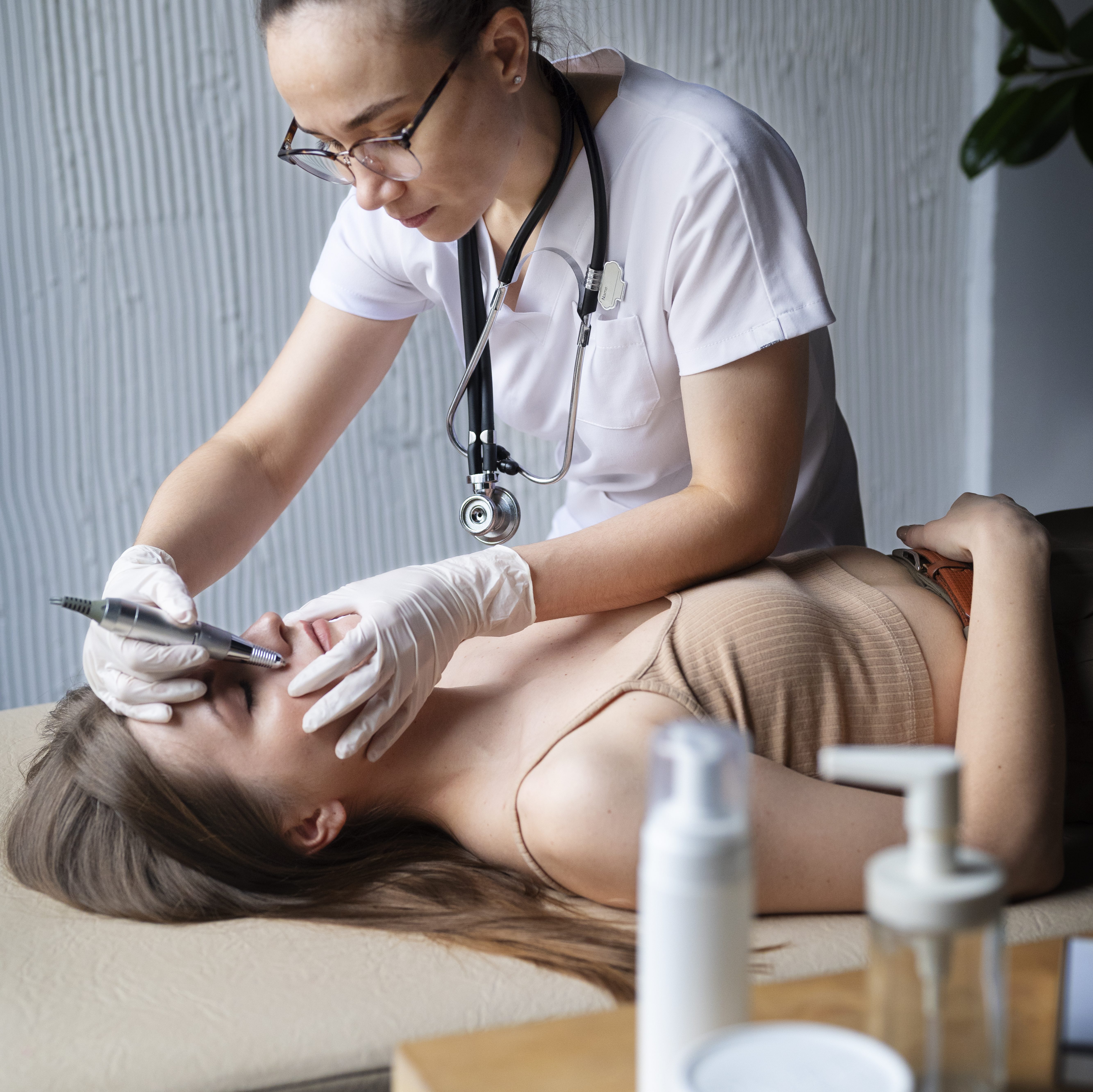 female-doctor-diagnosing-melanoma-body-female-patient